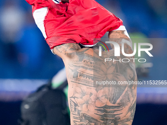 Theo Hernandez of AC Milan shows his tattoos during the Serie A Enilive match between SS Lazio and AC Milan at Stadio Olimpico on Aug 31, 20...