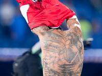 Theo Hernandez of AC Milan shows his tattoos during the Serie A Enilive match between SS Lazio and AC Milan at Stadio Olimpico on Aug 31, 20...