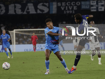 Parma's Zion Suzuki and David Neres of Napoli during the Serie A soccer match between SSC Napoli and Parma Calcio at Stadio Maradona in Napl...