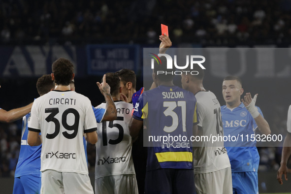 Parma's Zion Suzuki and David Neres of Napoli during the Serie A soccer match between SSC Napoli and Parma Calcio at Stadio Maradona in Napl...