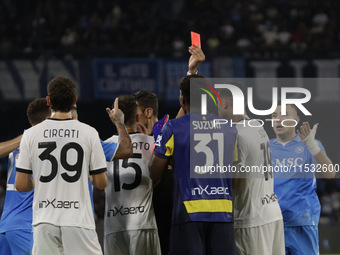 Parma's Zion Suzuki and David Neres of Napoli during the Serie A soccer match between SSC Napoli and Parma Calcio at Stadio Maradona in Napl...