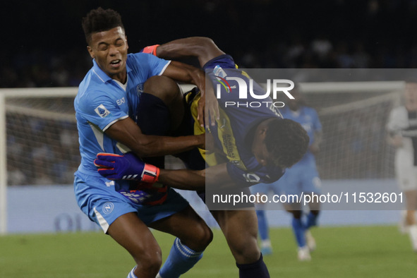 Parma's Zion Suzuki and David Neres of Napoli during the Serie A soccer match between SSC Napoli and Parma Calcio at Stadio Maradona in Napl...