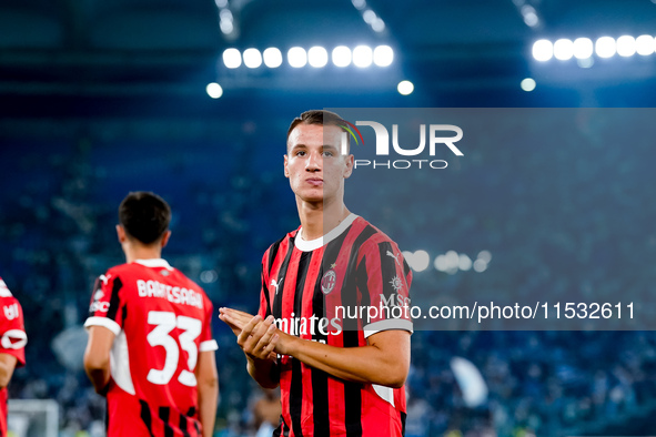 Francesco Camarda of AC Milan greets the fans during the Serie A Enilive match between SS Lazio and AC Milan at Stadio Olimpico on Aug 31, 2...