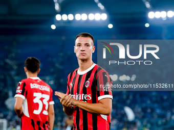 Francesco Camarda of AC Milan greets the fans during the Serie A Enilive match between SS Lazio and AC Milan at Stadio Olimpico on Aug 31, 2...