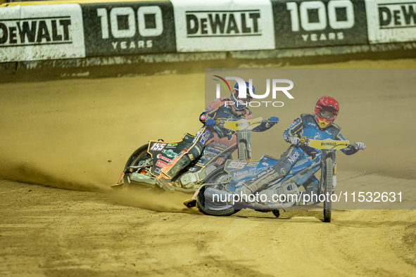 Mikkel Michelsen and Robert Lambert participate in a FIM Speedway Grand Prix in Wroclaw, Poland, on August 31, 2024. 