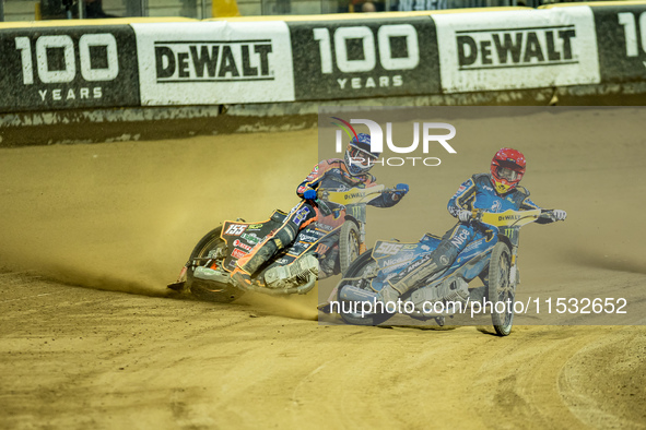 Mikkel Michelsen and Robert Lambert participate in a FIM Speedway Grand Prix in Wroclaw, Poland, on August 31, 2024. 