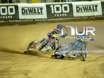 Mikkel Michelsen and Robert Lambert participate in a FIM Speedway Grand Prix in Wroclaw, Poland, on August 31, 2024. (