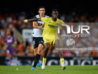 Thierno Barry of Villarreal CF competes for the ball with Cesar Tarrega of Valencia CF during the LaLiga EA Sports match between Valencia CF...