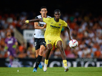 Thierno Barry of Villarreal CF competes for the ball with Cesar Tarrega of Valencia CF during the LaLiga EA Sports match between Valencia CF...