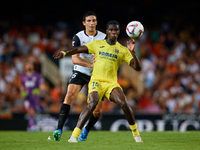 Thierno Barry of Villarreal CF competes for the ball with Cesar Tarrega of Valencia CF during the LaLiga EA Sports match between Valencia CF...