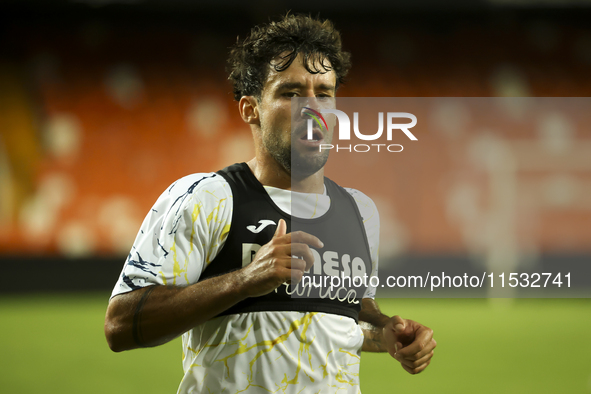 Juan Bernat of Villarreal CF and Ruben Baraja after the La Liga match between Valencia CF and Villarreal CF at Mestalla Stadium in Valencia,...