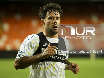 Juan Bernat of Villarreal CF and Ruben Baraja after the La Liga match between Valencia CF and Villarreal CF at Mestalla Stadium in Valencia,...