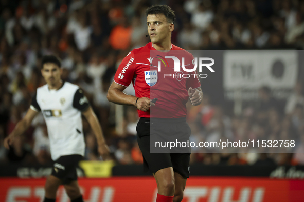 Jesus Gil Manzano referees during the La Liga match between Valencia CF and Villarreal CF at Mestalla Stadium in Valencia, Spain, on August...