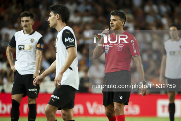 Jesus Gil Manzano referees during the La Liga match between Valencia CF and Villarreal CF at Mestalla Stadium in Valencia, Spain, on August...