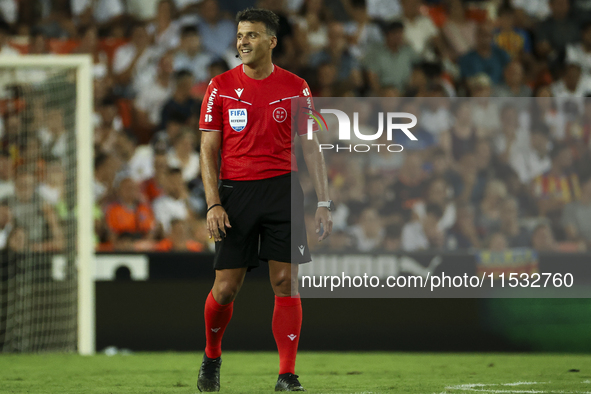 Jesus Gil Manzano referees during the La Liga match between Valencia CF and Villarreal CF at Mestalla Stadium in Valencia, Spain, on August...