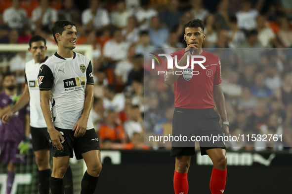 Jesus Gil Manzano referees during the La Liga match between Valencia CF and Villarreal CF at Mestalla Stadium in Valencia, Spain, on August...