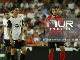 Jesus Gil Manzano referees during the La Liga match between Valencia CF and Villarreal CF at Mestalla Stadium in Valencia, Spain, on August...