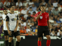 Jesus Gil Manzano referees during the La Liga match between Valencia CF and Villarreal CF at Mestalla Stadium in Valencia, Spain, on August...