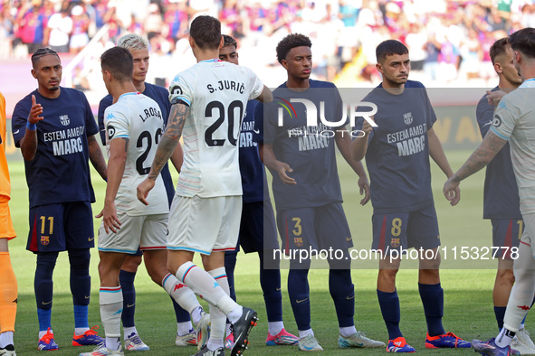 FC Barcelona players display a message of support for Marc Bernal during the match between FC Barcelona and Real Valladolid CF, correspondin...