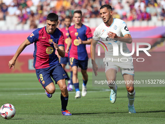 Pedri and Selim Amallah play during the match between FC Barcelona and Real Valladolid CF, corresponding to week 4 of LaLiga EA Sports, at t...