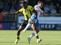 Harrogate Town's Sam Folarin is fouled by Barrow's Robbie Gotts during the Sky Bet League 2 match between Harrogate Town and Barrow at Wethe...