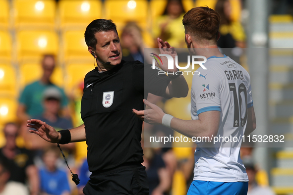 Barrow's Ged Garner appeals to Referee Scott Simpson during the Sky Bet League 2 match between Harrogate Town and Barrow at Wetherby Road in...