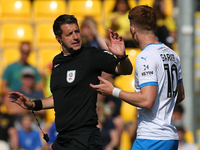 Barrow's Ged Garner appeals to Referee Scott Simpson during the Sky Bet League 2 match between Harrogate Town and Barrow at Wetherby Road in...