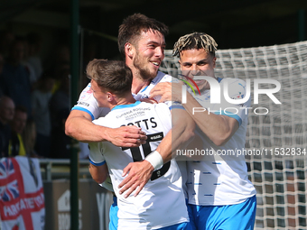 Barrow's Robbie Gotts (L), Barrow's Niall Canavan (M), and Barrow's Theo Vassell (R) celebrate a disallowed goal during the Sky Bet League 2...