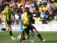 Barrow's Emile Acquah fouls Harrogate Town's Anthony O'Connor during the Sky Bet League 2 match between Harrogate Town and Barrow at Wetherb...