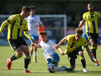 Barrow's Ged Garner is fouled by Harrogate Town's Stephen Duke-McKenna during the Sky Bet League 2 match between Harrogate Town and Barrow a...