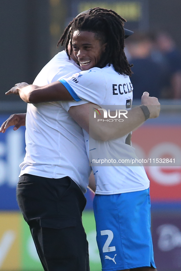 Barrow Manager Stephen Clemence celebrates with Barrow's Neo Eccleston during the Sky Bet League 2 match between Harrogate Town and Barrow a...