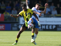 Barrow's Robbie Gotts wins the ball from Harrogate Town's Sam Folarin during the Sky Bet League 2 match between Harrogate Town and Barrow at...