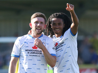 Barrow's Ben Jackson and Barrow's Neo Eccleston celebrate at full time during the Sky Bet League 2 match between Harrogate Town and Barrow a...