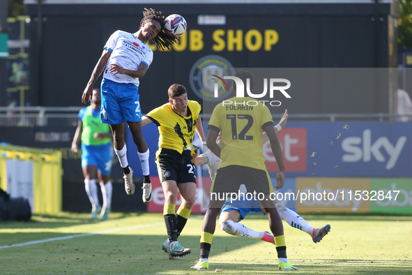 Barrow's Neo Eccleston wins a header during the Sky Bet League 2 match between Harrogate Town and Barrow at Wetherby Road in Harrogate, Engl...