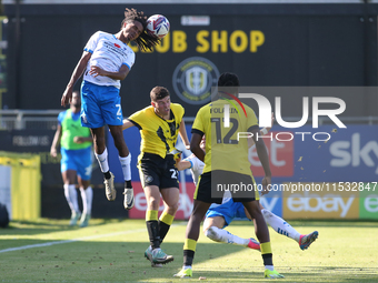 Barrow's Neo Eccleston wins a header during the Sky Bet League 2 match between Harrogate Town and Barrow at Wetherby Road in Harrogate, Engl...