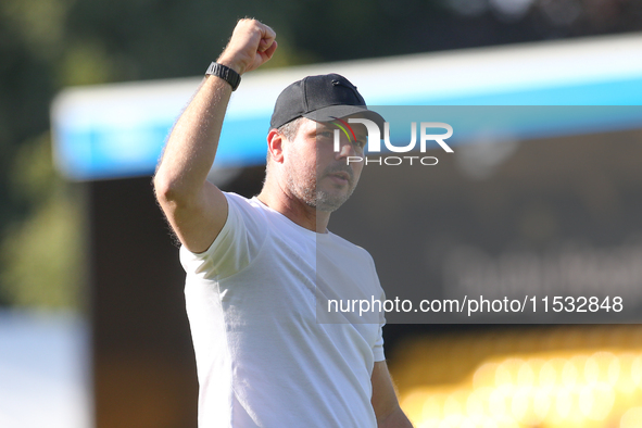 Barrow Manager Stephen Clemence celebrates at full time during the Sky Bet League 2 match between Harrogate Town and Barrow at Wetherby Road...