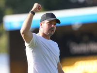 Barrow Manager Stephen Clemence celebrates at full time during the Sky Bet League 2 match between Harrogate Town and Barrow at Wetherby Road...