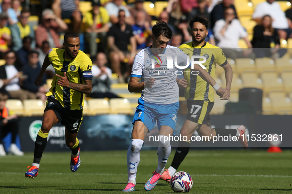 Barrow's Chris Popov runs with the ball during the Sky Bet League 2 match between Harrogate Town and Barrow at Wetherby Road in Harrogate, E...