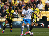 Barrow's Chris Popov runs with the ball during the Sky Bet League 2 match between Harrogate Town and Barrow at Wetherby Road in Harrogate, E...