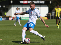 Ben Jackson of Barrow crosses a ball during the Sky Bet League 2 match between Harrogate Town and Barrow at Wetherby Road in Harrogate, Engl...