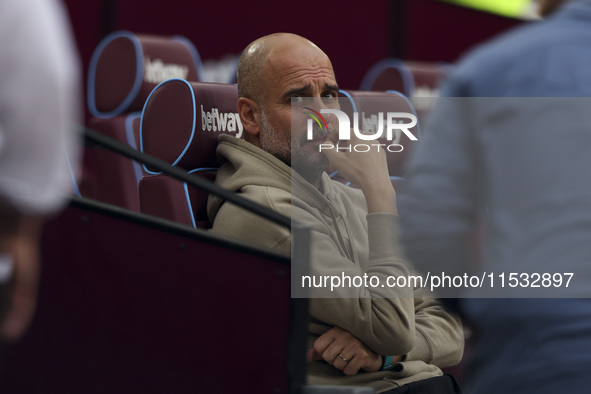 Pep Guardiola of Manchester City during the Premier League match between West Ham United and Manchester City at the London Stadium in Stratf...