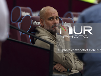 Pep Guardiola of Manchester City during the Premier League match between West Ham United and Manchester City at the London Stadium in Stratf...