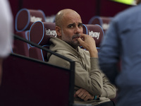 Pep Guardiola of Manchester City during the Premier League match between West Ham United and Manchester City at the London Stadium in Stratf...