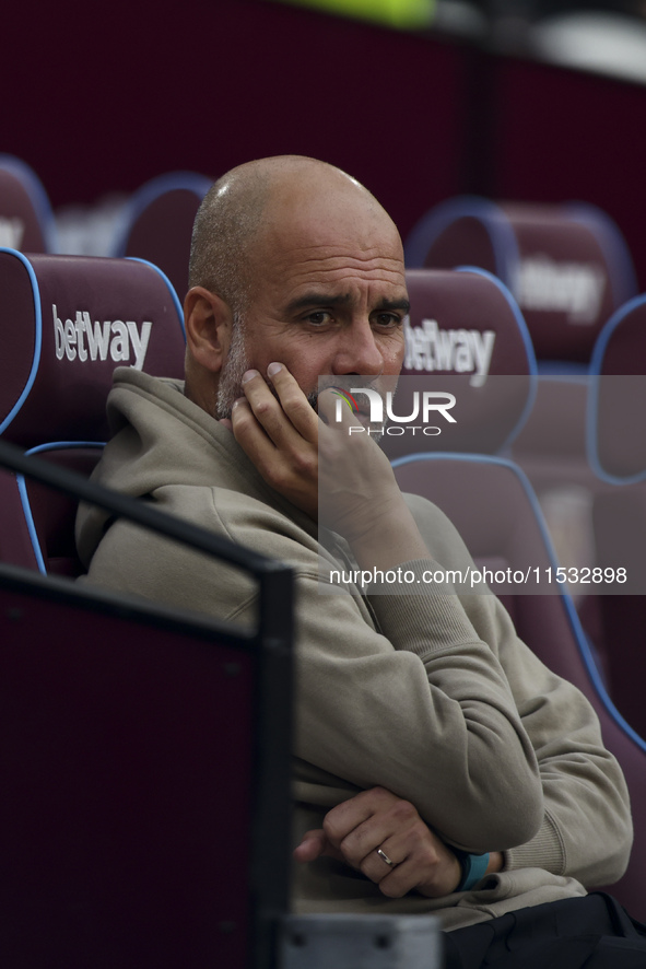 Pep Guardiola of Manchester City during the Premier League match between West Ham United and Manchester City at the London Stadium in Stratf...