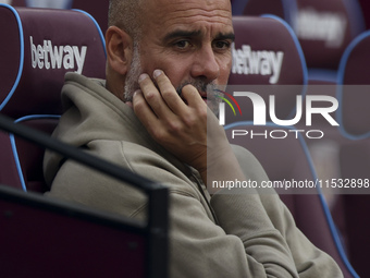 Pep Guardiola of Manchester City during the Premier League match between West Ham United and Manchester City at the London Stadium in Stratf...