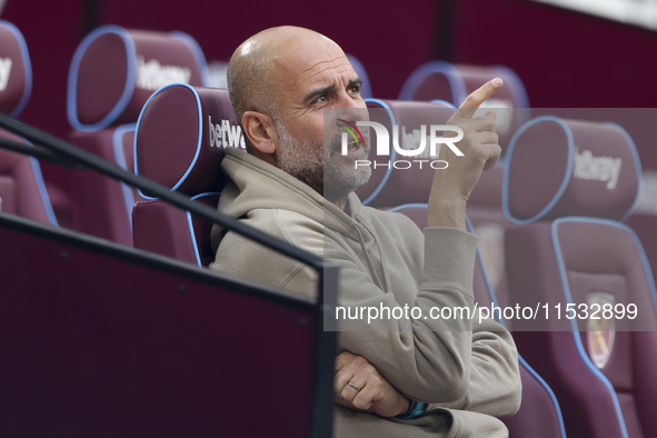 Pep Guardiola of Manchester City during the Premier League match between West Ham United and Manchester City at the London Stadium in Stratf...