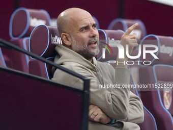 Pep Guardiola of Manchester City during the Premier League match between West Ham United and Manchester City at the London Stadium in Stratf...