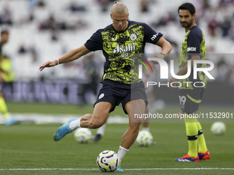 Erling Haaland of Manchester City warms up during the Premier League match between West Ham United and Manchester City at the London Stadium...