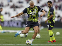 Erling Haaland of Manchester City warms up during the Premier League match between West Ham United and Manchester City at the London Stadium...