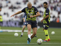 Erling Haaland of Manchester City shoots in the warm-up during the Premier League match between West Ham United and Manchester City at the L...